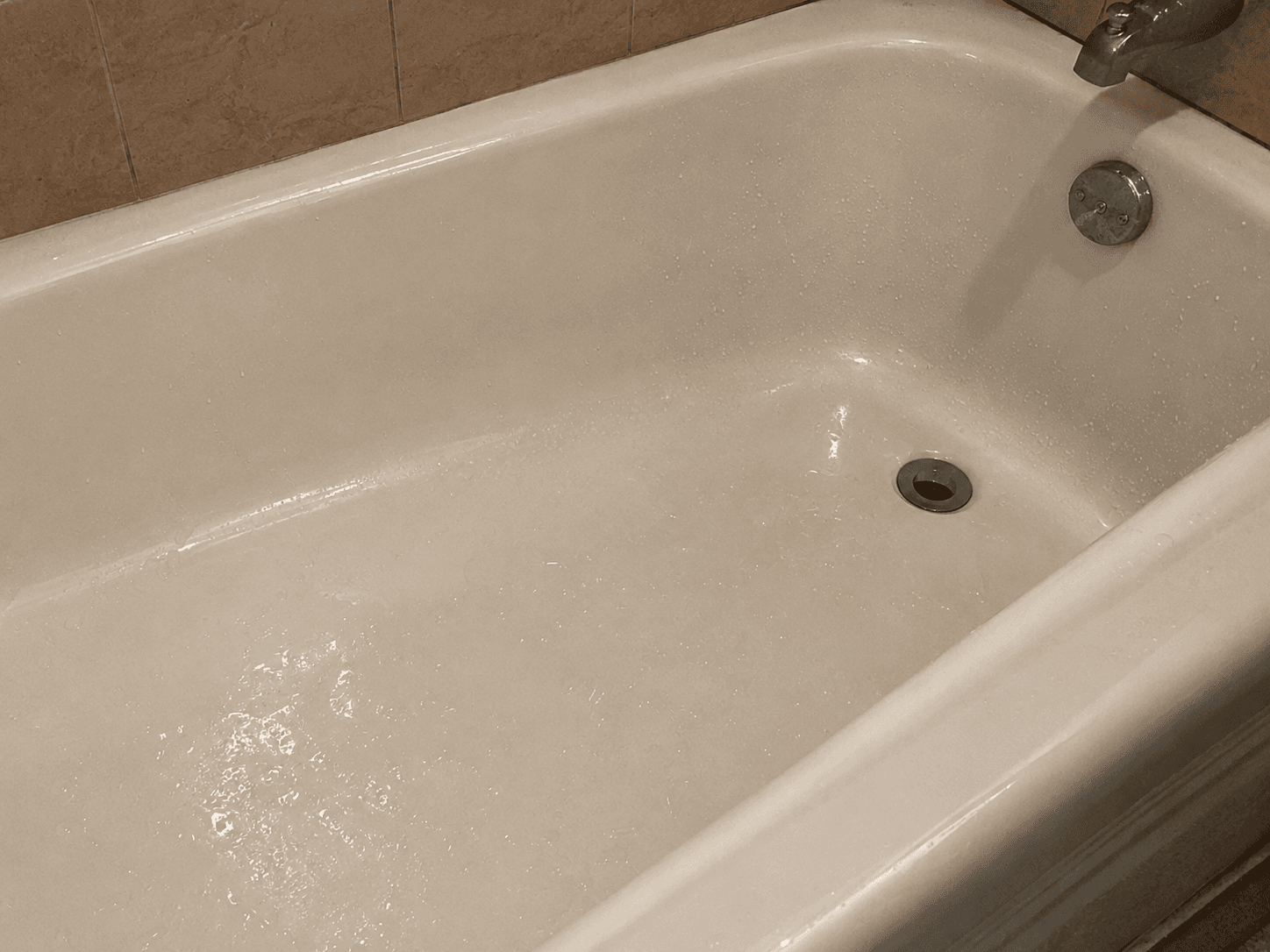 Wet and slippery bathtub creating a fall hazard