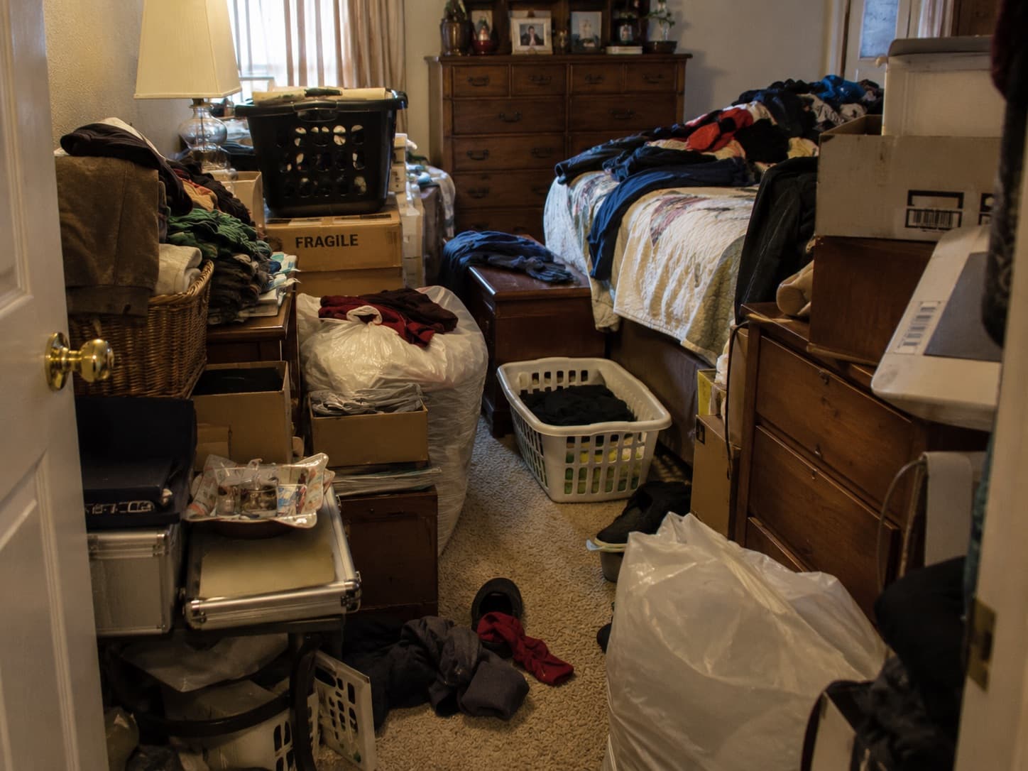 Clutter creating a fall or trip hazard in the bedroom