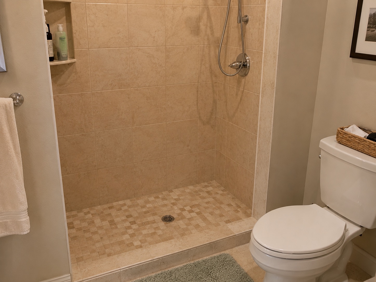 Shower with no bench or seat creating a fall risk