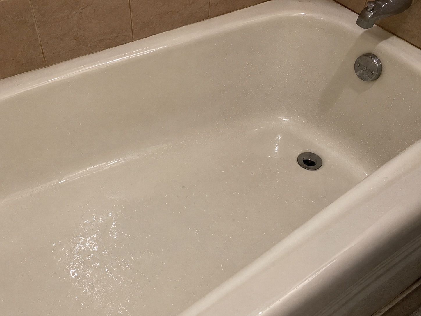 Wet and slippery bathtub creating a fall hazard