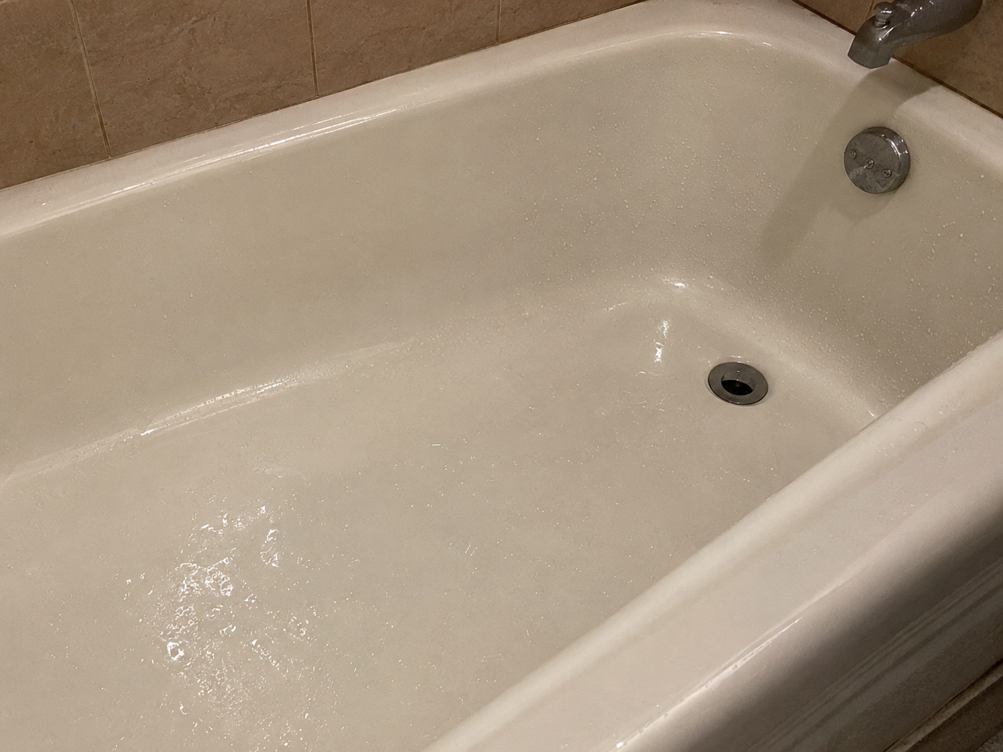 Wet and slippery bathtub creating a fall hazard