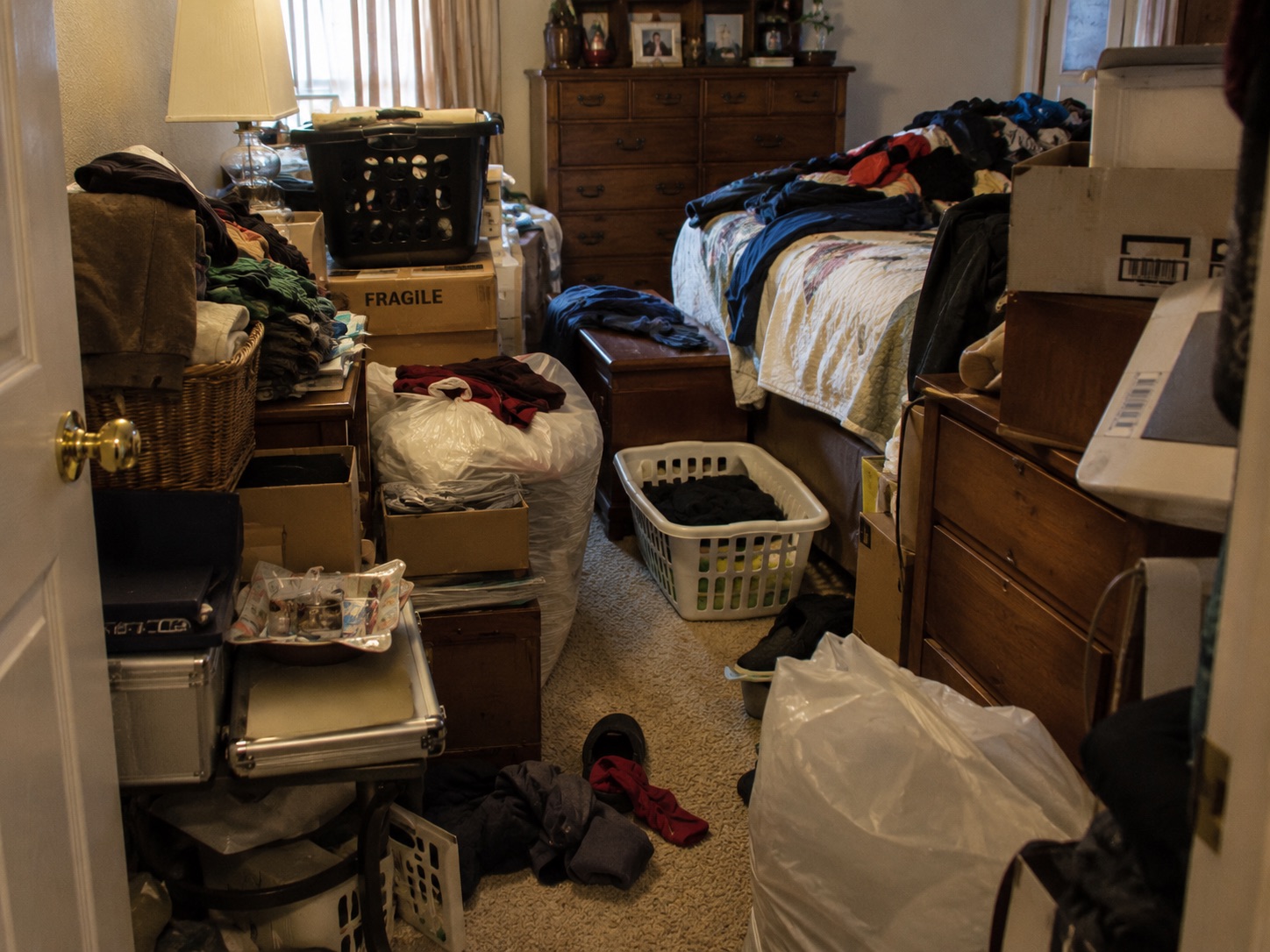 Clutter creating a fall or trip hazard in the bedroom