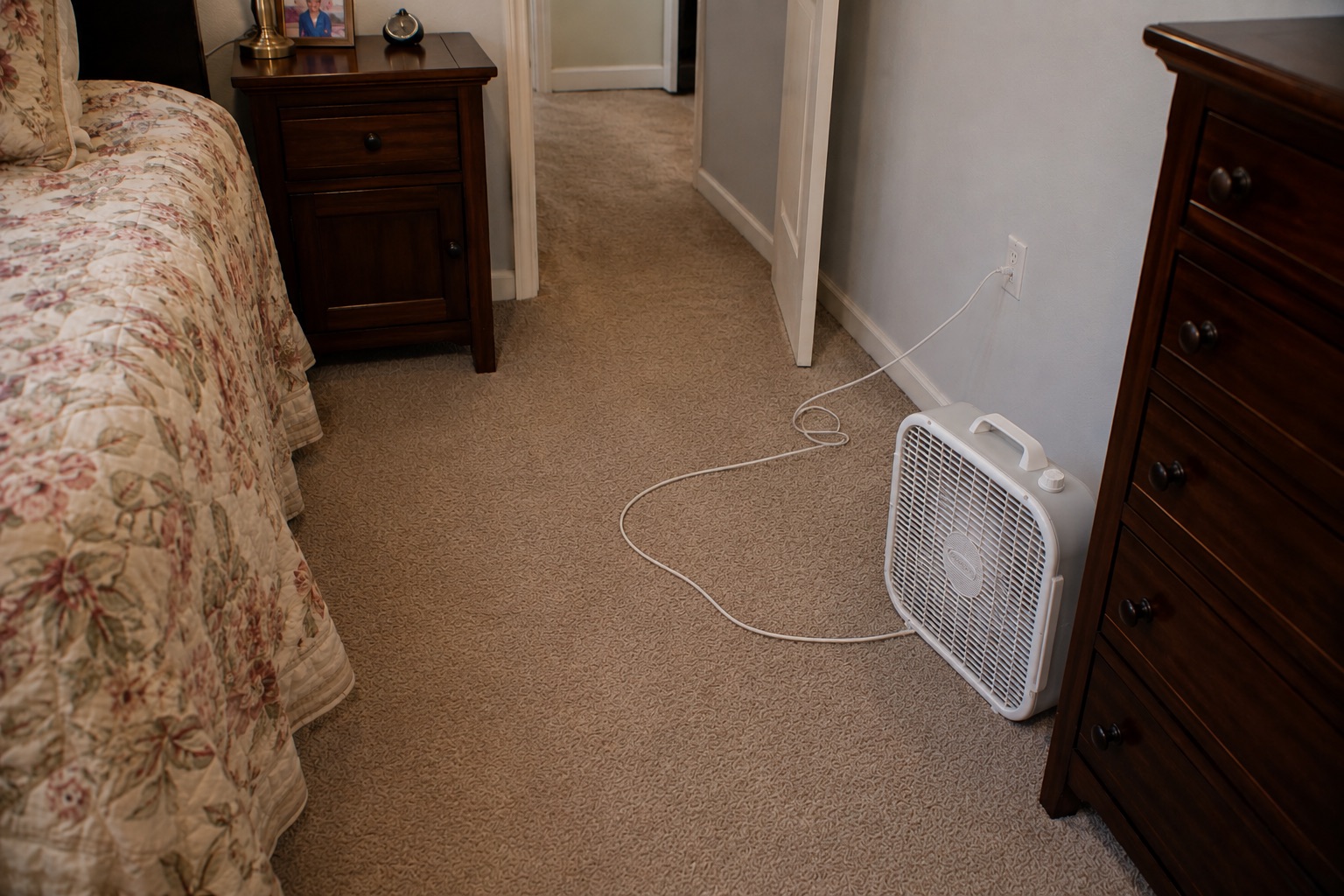 Electrical cord creating a trip hazard in the bedroom