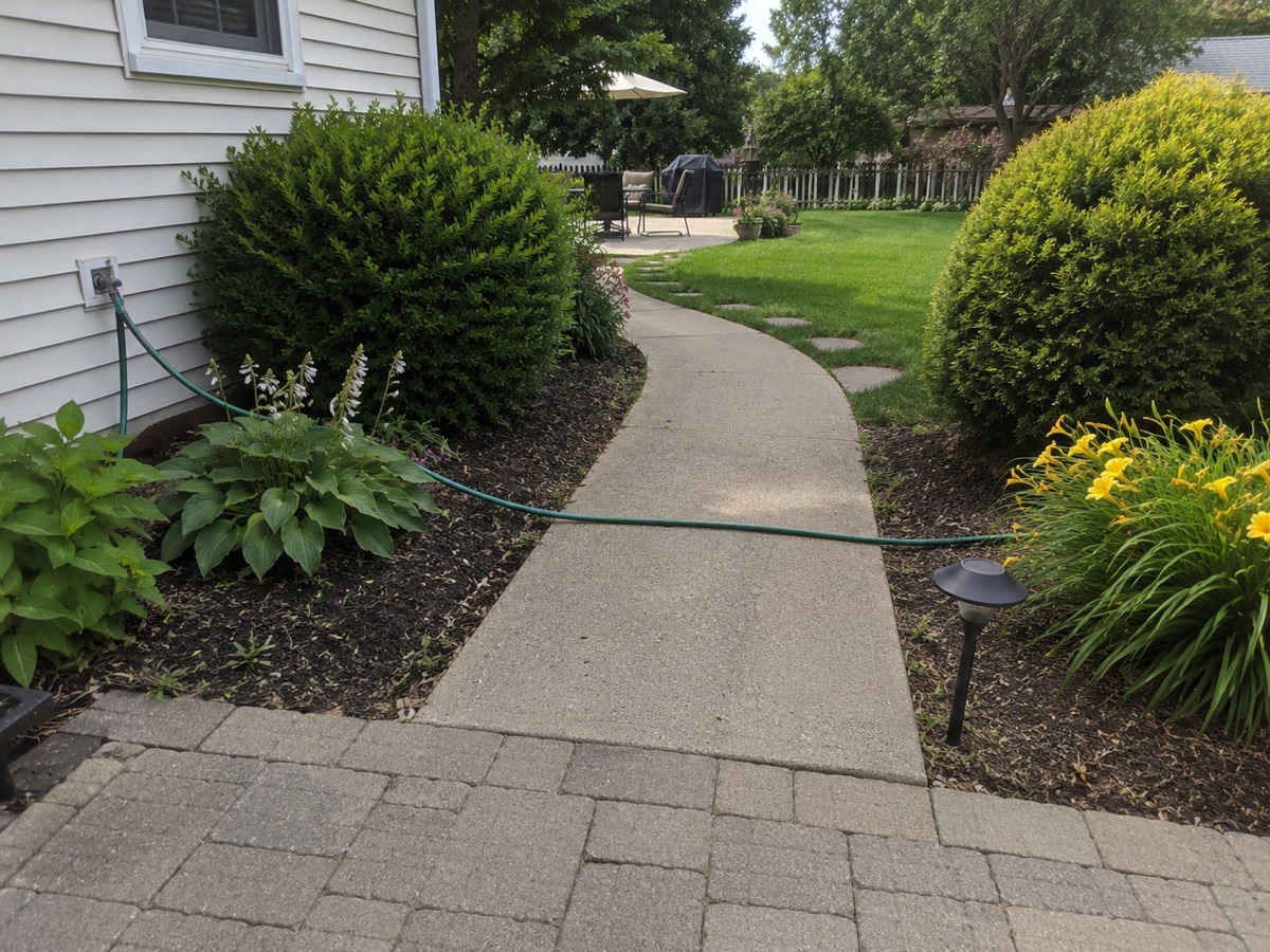 Garden hose creating a tripping hazard