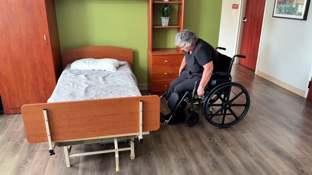 Wheelchair to bed: leg rests obstacle