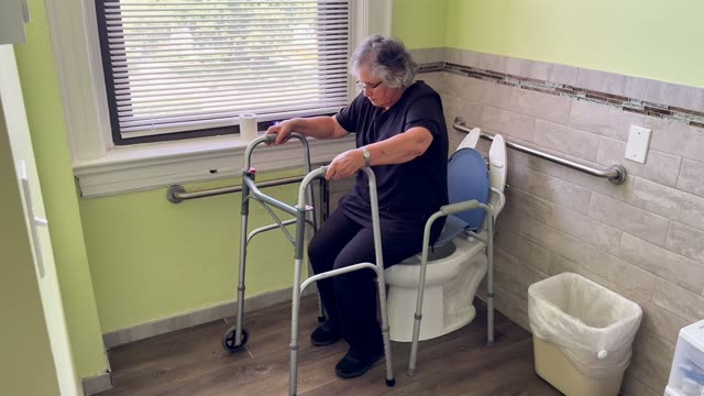 Toilet to walker: pulling on walker