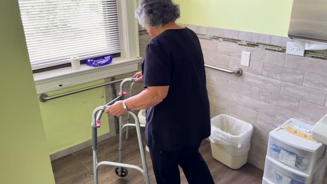 Walker to toilet: left walker behind